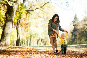 Mother and son in autumn park